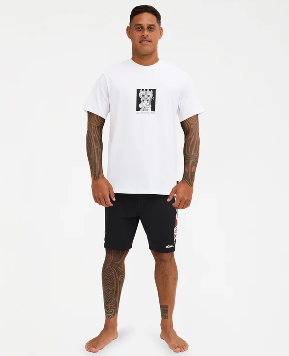 Quiksilver Tai Kehu Marakihau Men's Maori T-Shirt in white on Kehu Butler in Quiksilver Maori boardshorts from the front
