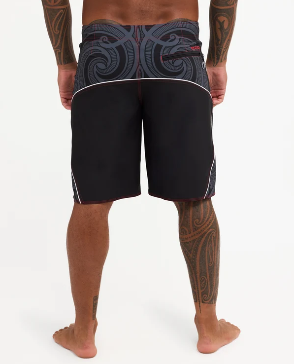 Quiksilver Tai Kehu Takarangi 21" Maori Boardshorts in black, white and red on Kehu Butler from the back