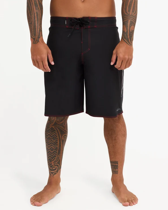 Quiksilver Tai Kehu Takarangi 21" Maori Boardshorts in black, white and red on Kehu Butler from the front
