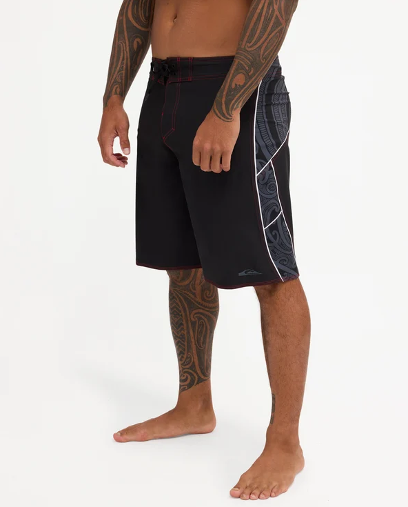Quiksilver Tai Kehu Takarangi 21" Maori Boardshorts in black, white and red on Kehu Butler from the left