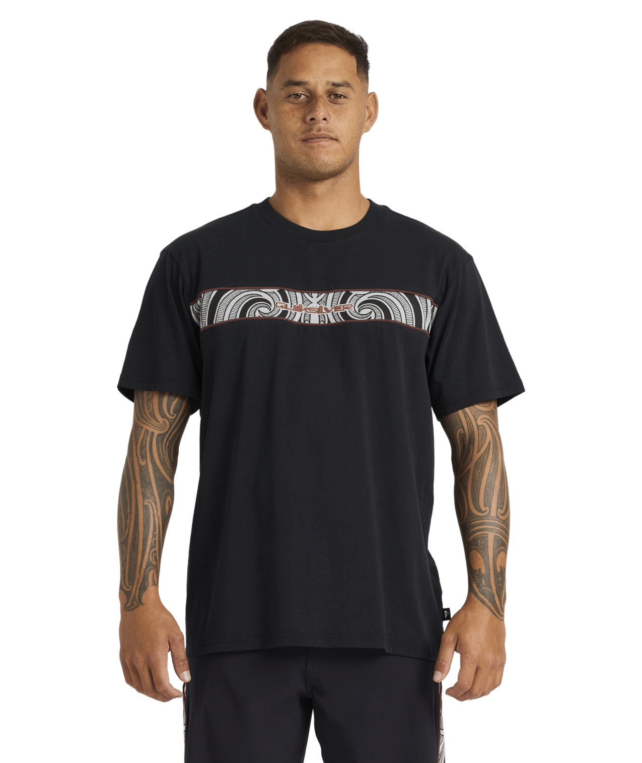 Quiksilver Tai Kehu Takarangi Panel T-Shirt in black on Kehu Butler close up in Maori boardshorts