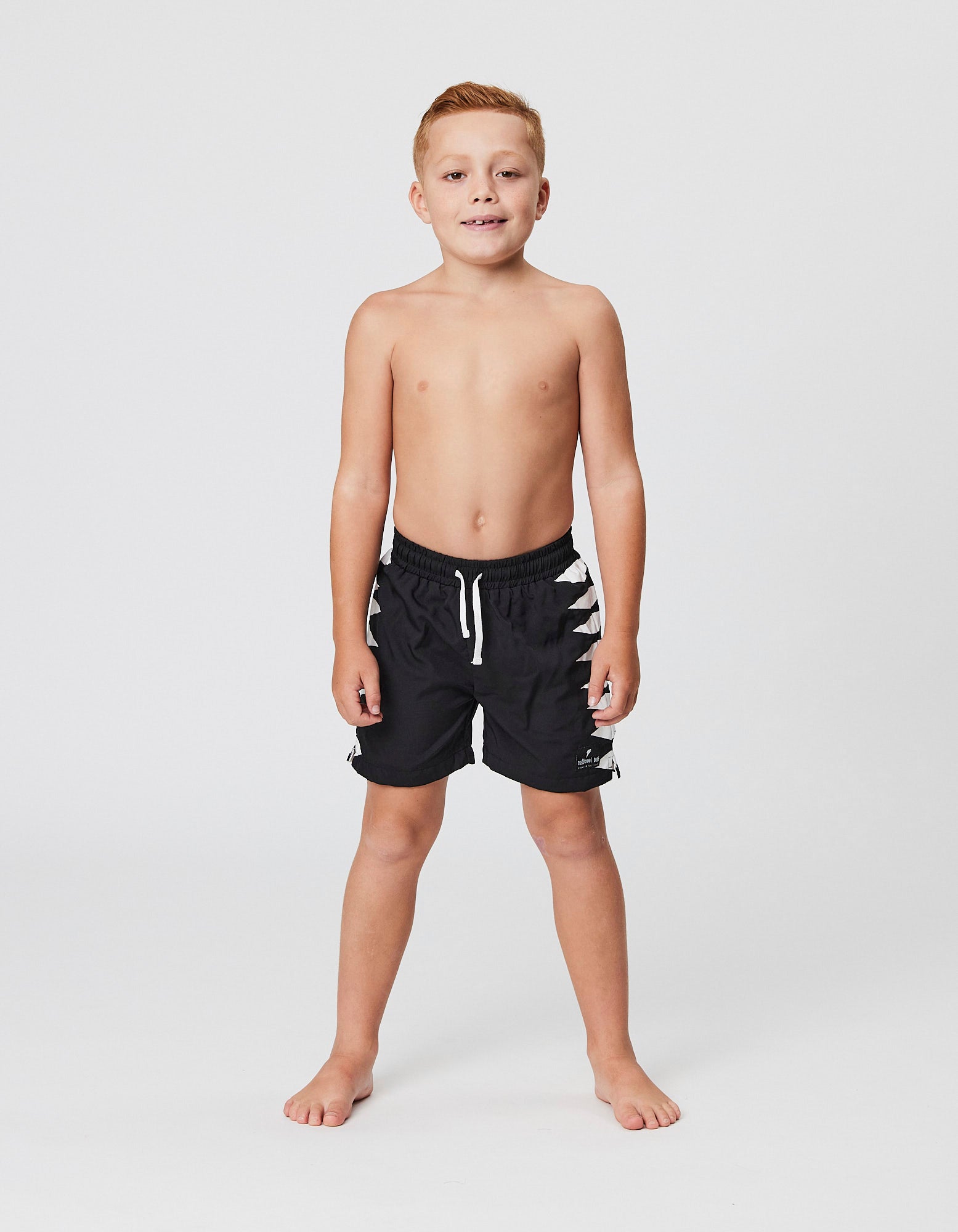 Radicool Kids Shark Teeth Boardshorts in black on model