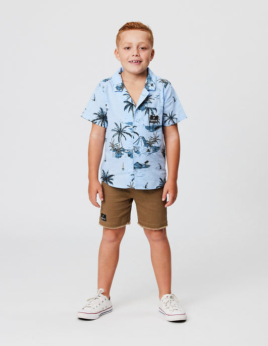 Radicool Kids Spice Denim Shorts in khaki colourway on model in blue hawaiian shirt