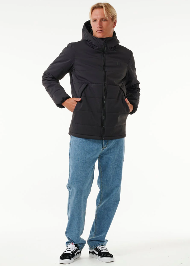 Rip Curl Anti Series Ridge Jacket in black on model in light blue jeans