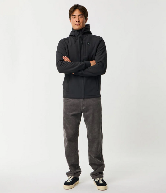 Rip Curl Anti-Series Viral Zip Thru Hoodie in black on model in dark coloured jeans