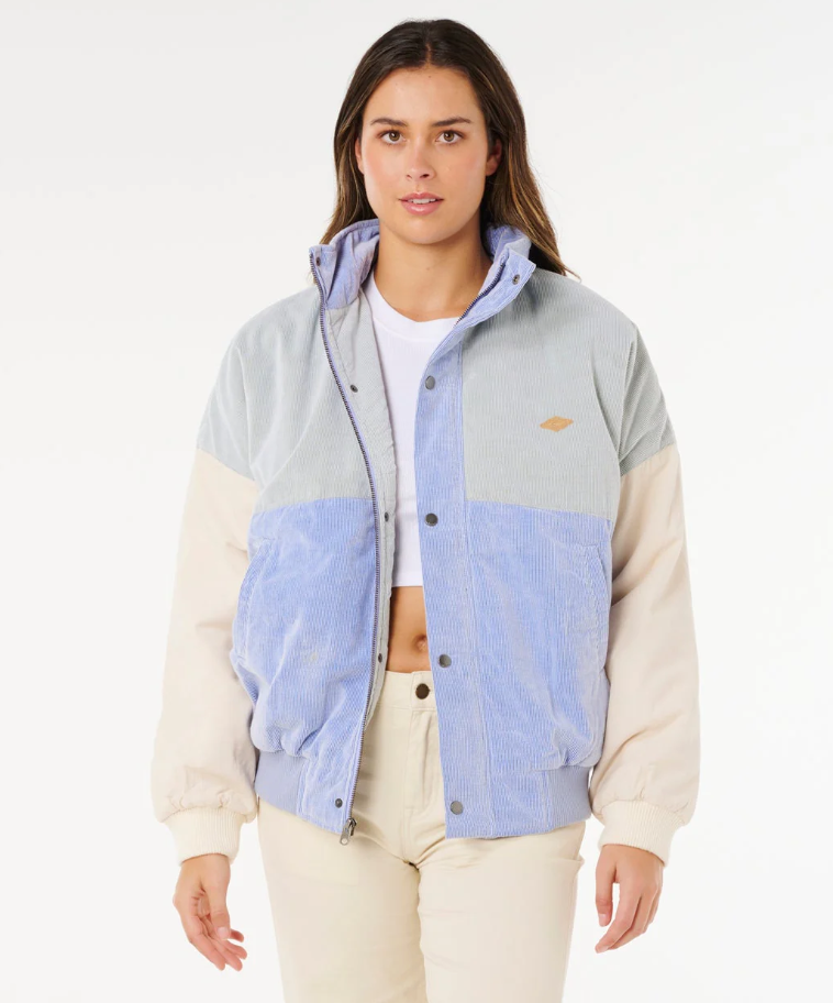 Rip Curl Cala Vadella Women's Corduroy Jacket in sage colourway with sky blue and off white panels from front on model