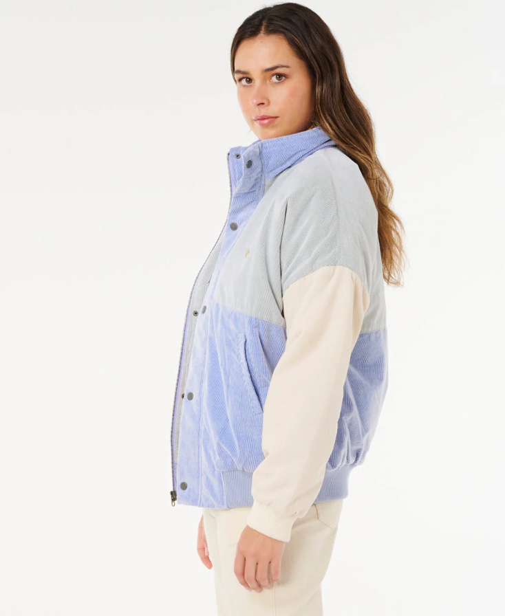 Rip Curl Cala Vadella Women's Corduroy Jacket in sage colourway with sky blue and off white panels on model from side