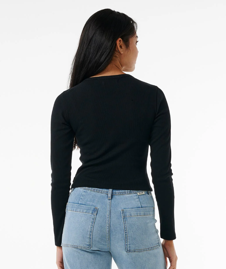Rip Curl Classic Ribbed Women's Long Sleeve Tee in black on model in blue jeans from rear