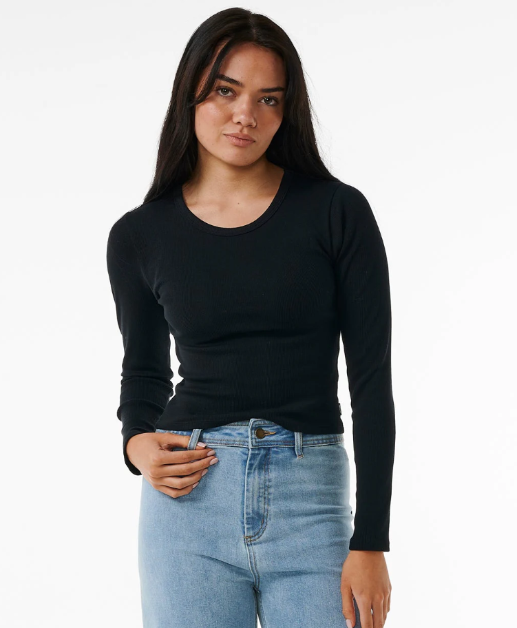 Rip Curl Classic Ribbed Women's Long Sleeve Tee in black on model in blue jeans from front close up
