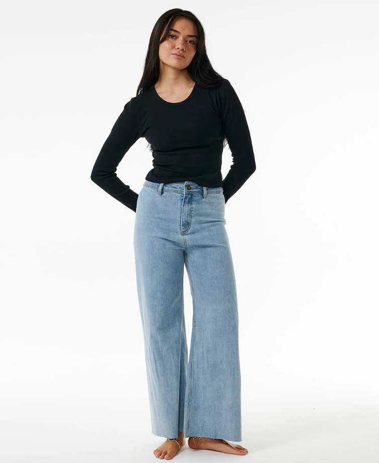 Rip Curl Classic Ribbed Women's Long Sleeve Tee in black on model in blue jeans from front