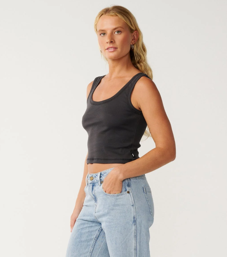 Rip Curl Classic Ribbed Women's Tank in washed black colour on model n blue jeans from the side