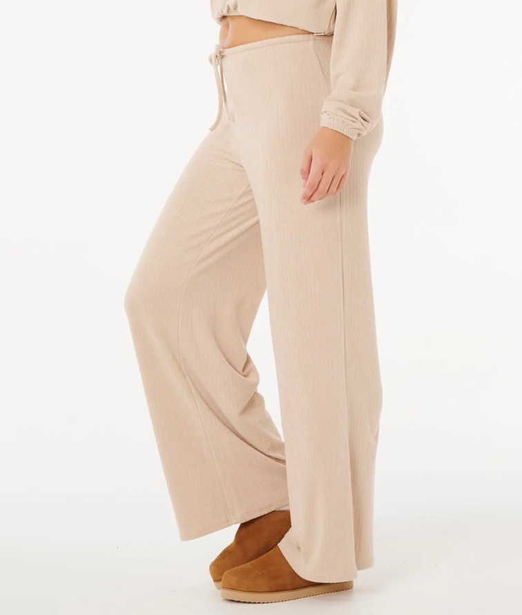 Rip Curl Cosy Cord Wide Leg Women's Pants in natural colourway on model from side close up