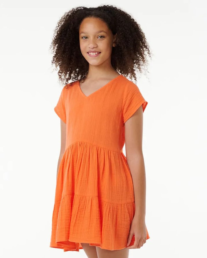 Rip Curl Girls Premium Surf Dress in bright orange colourway on model