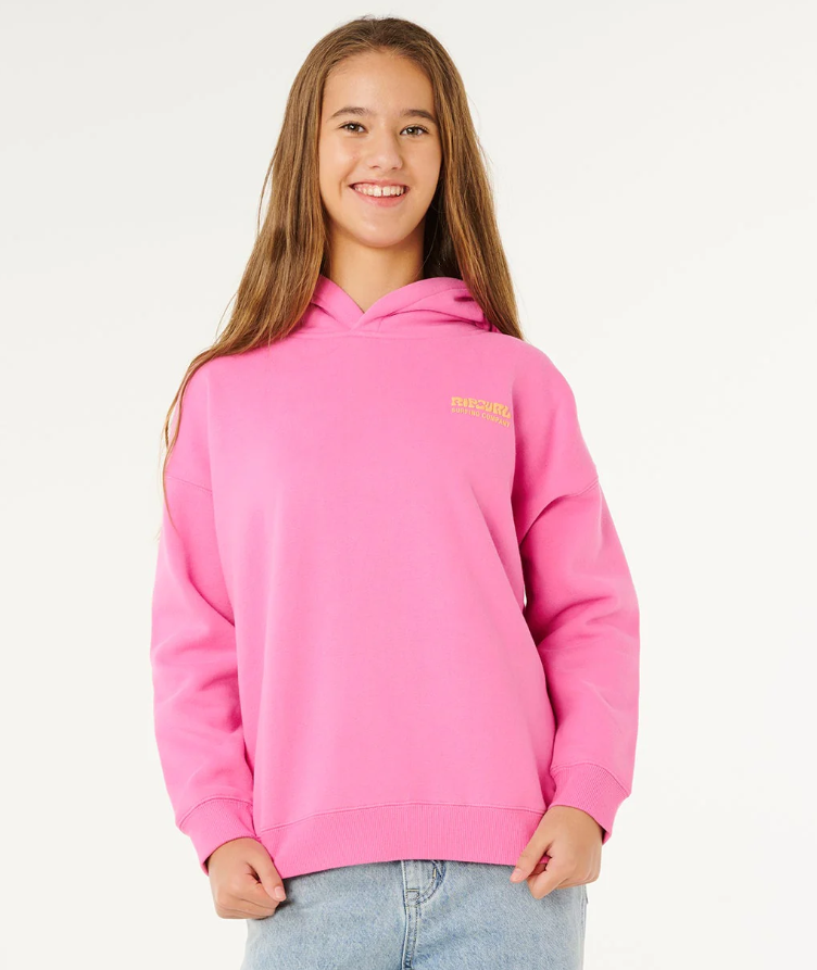 Rip Curl Girl's Surf Puff Heritage Hoodie in pink on model in light blue jeans from front close up