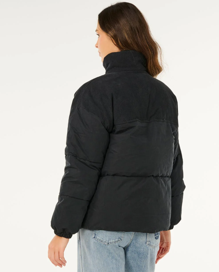 Rip Curl High Tide Mixed Cord Puffer Jacket in washed black on model from rear