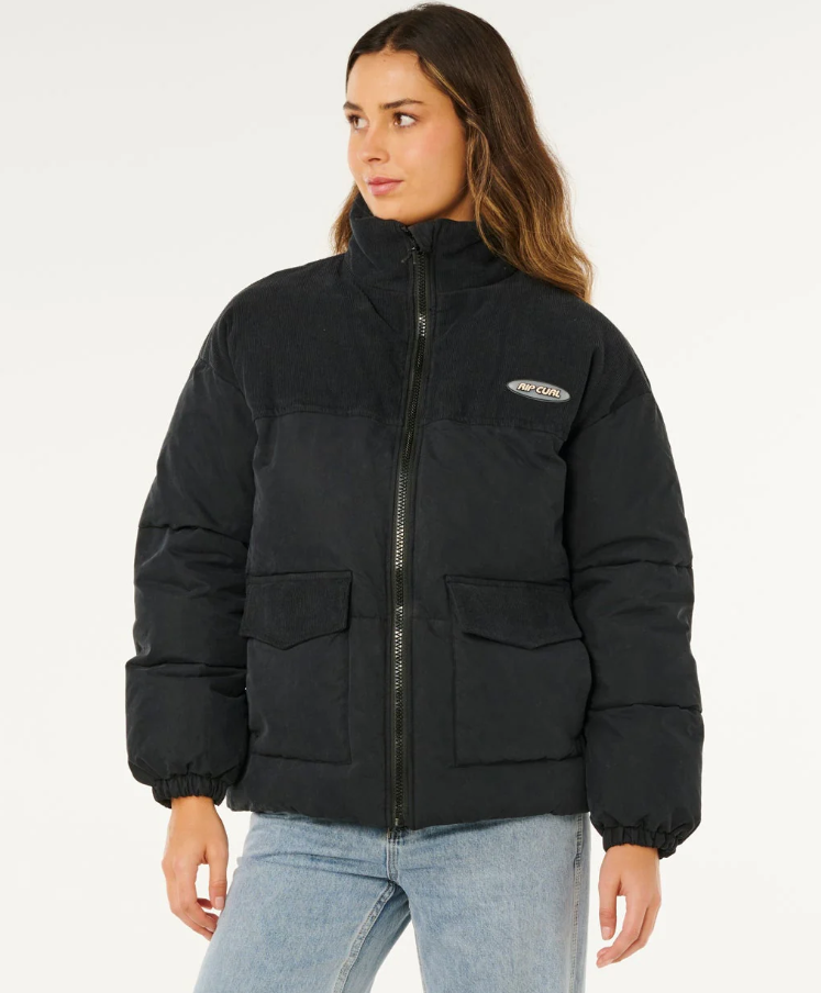 Rip Curl High Tide Mixed Cord Puffer Jacket in washed black on model from front close up