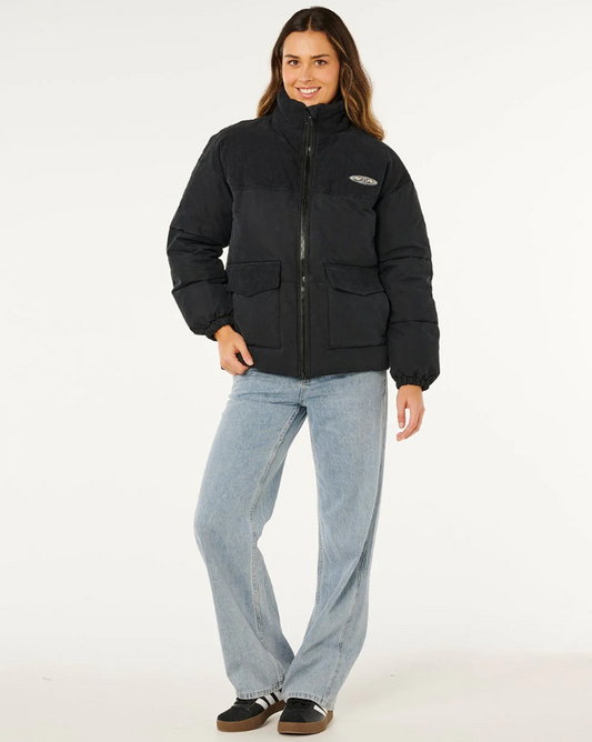 Rip Curl High Tide Mixed Cord Puffer Jacket in washed black on model from front