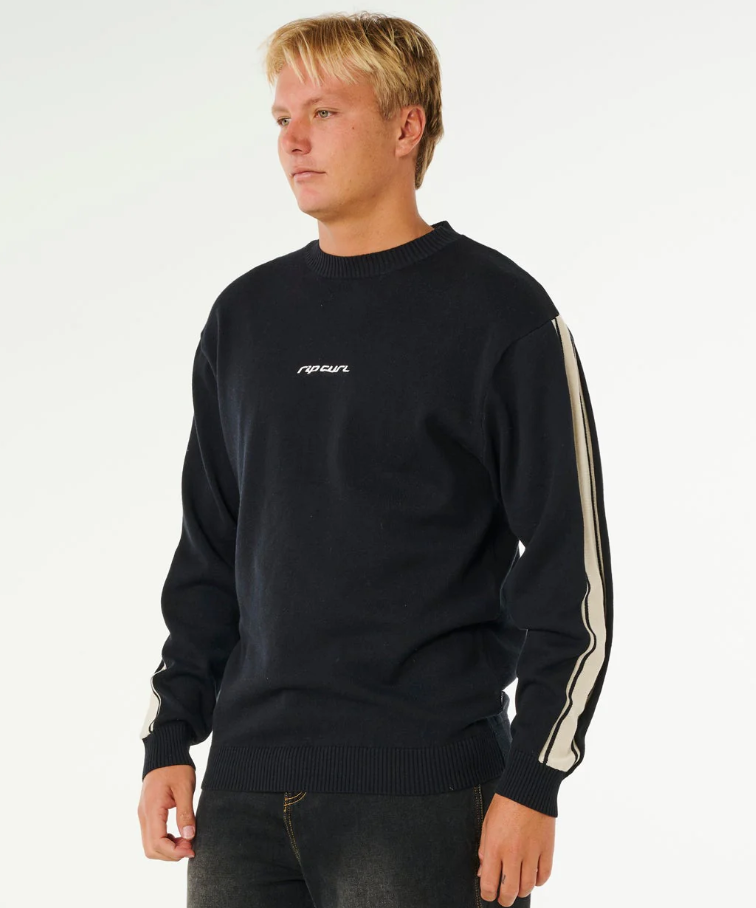 Rip Curl Inner Visions Stripe Knit Crew in black on model from side view
