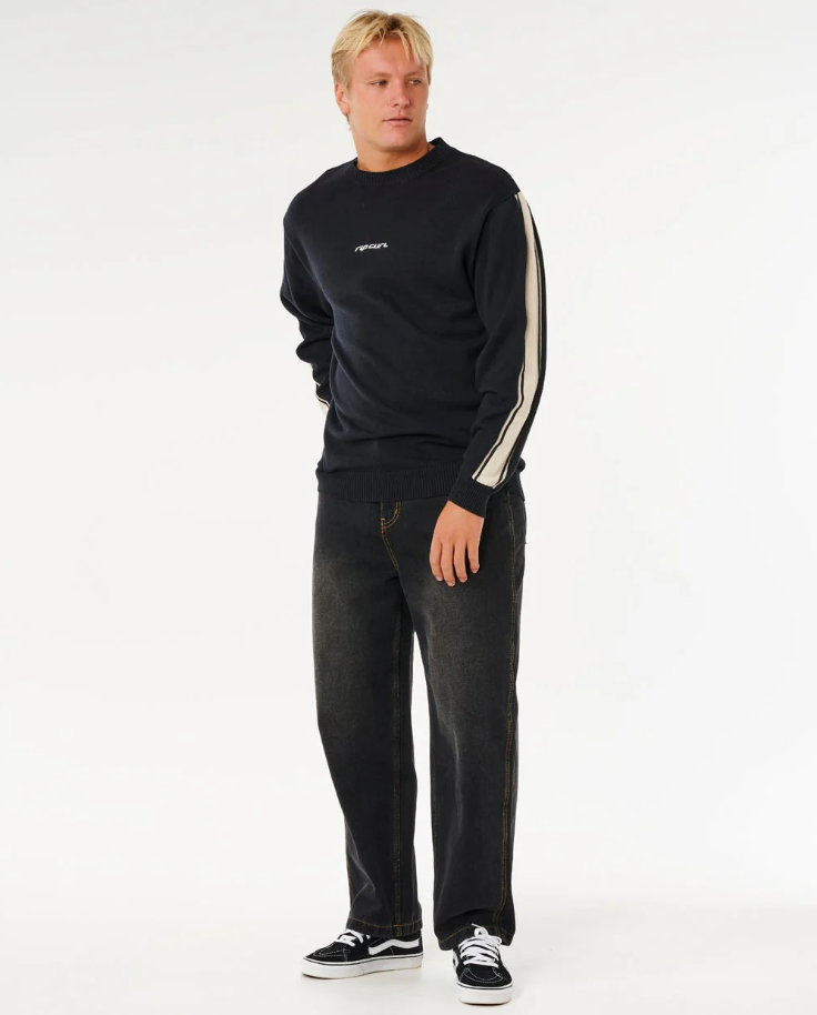 Rip Curl Inner Visions Stripe Knit Crew in black on model in black jeans from front