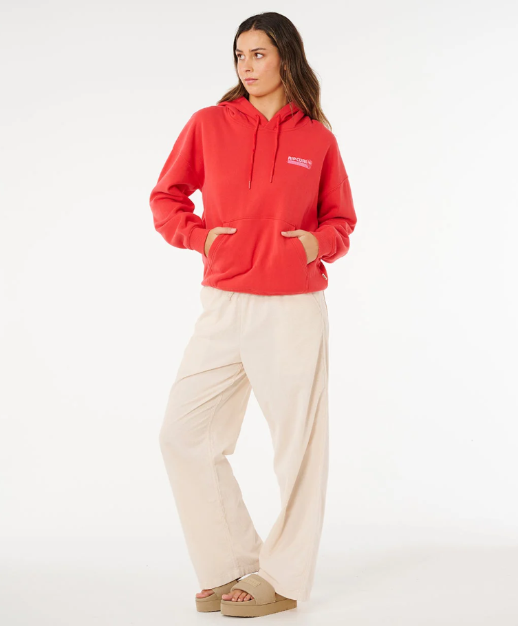 Rip Curl Ocean Break Heritage Hoodie in deep red on model in beige pants