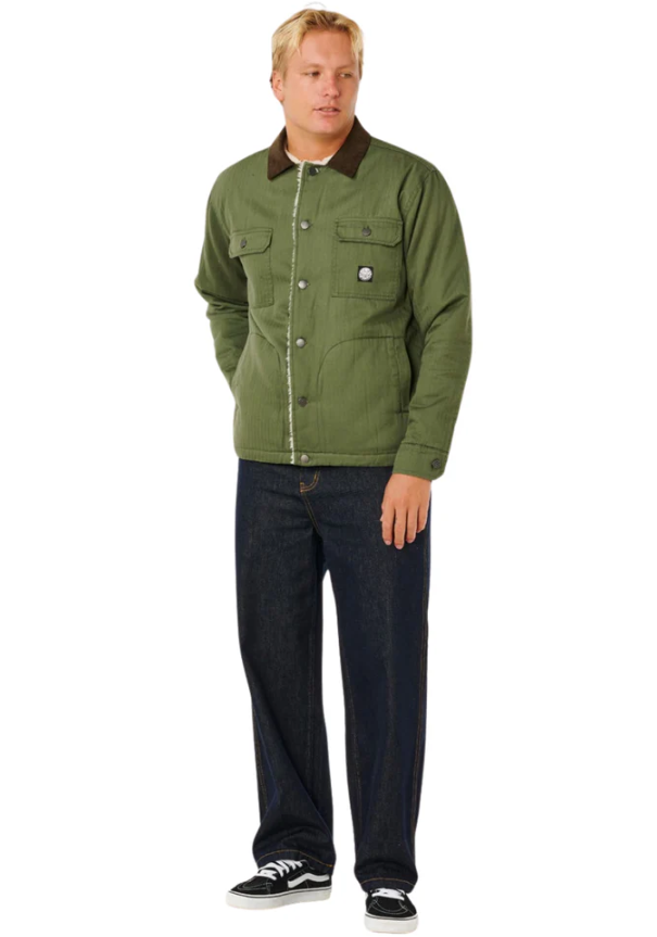 Rip Curl Premium Surf Sherpa Jacket in dark olive on Korbin Hutchings in indigo jeans from front
