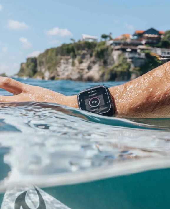 Rip Curl Search GPS 3 Watch on surfers wrist at beach