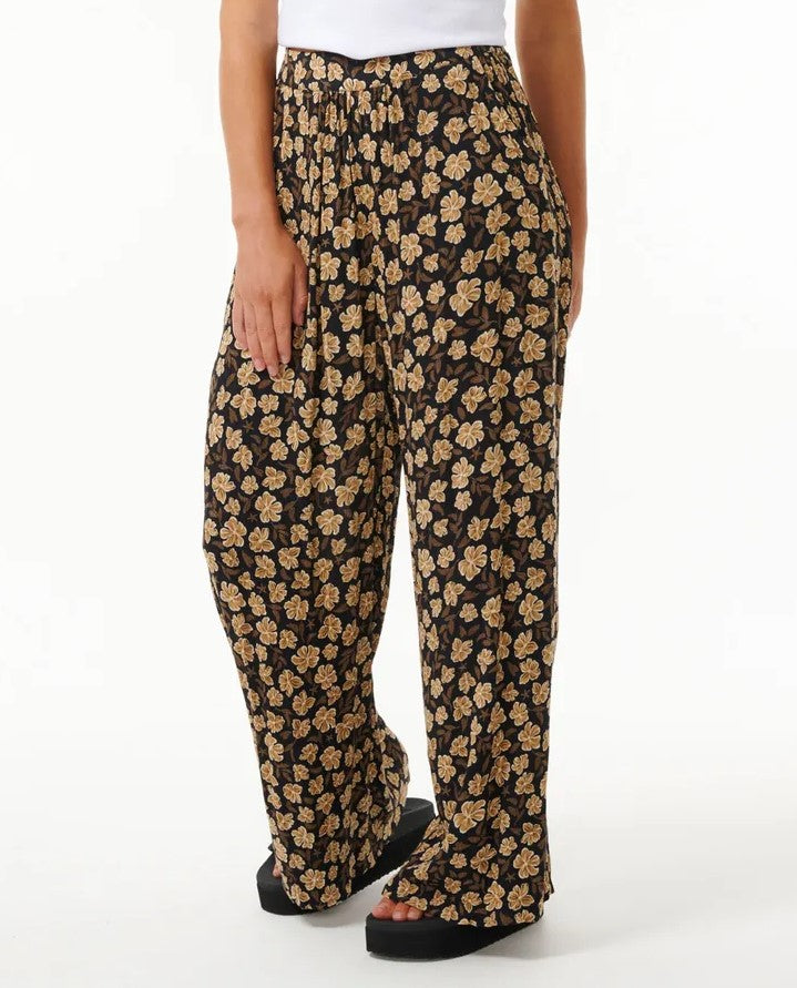 Rip Curl Soleil Pants in black with floral detail from front