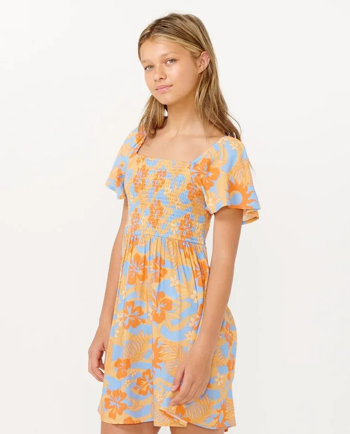 Rip Curl Girls Sun Sol Shirred Dress in orange from front/side on model