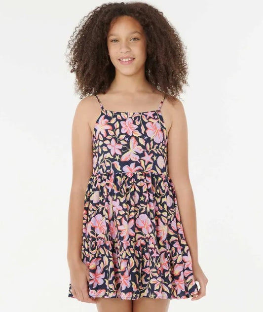 Rip Curl Sunset Skies Girls Dress  in navy  with floral print on dakr haired model from front