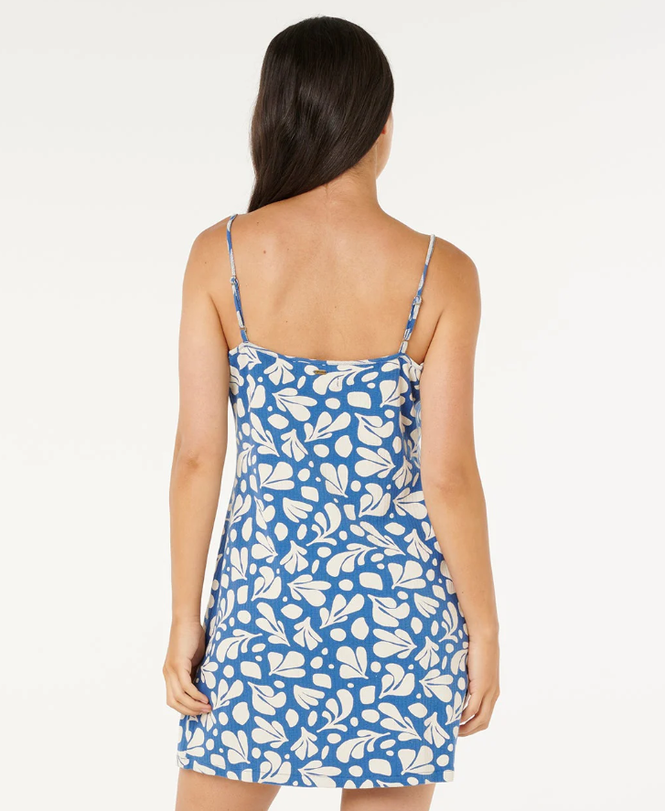 Rip Curl Surf Dreams Printed Mini Dress in blue modern floral print on model from rear