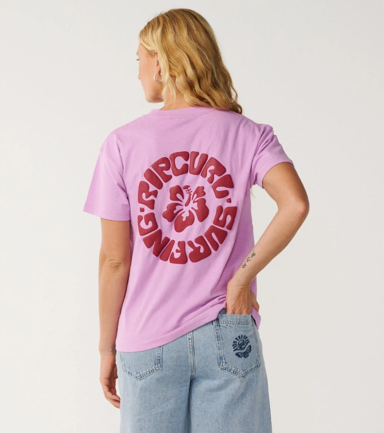 Rip Curl Surf Puff Party Relaxed Tee in bright lilac colourway showing the rear with large puff print in maroon