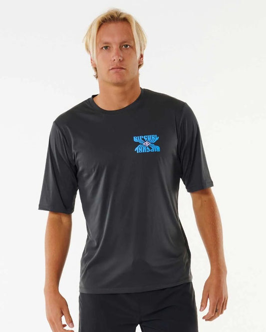 Blonde model wearing Rip Curl SWC Solar Surflite UPF Men's S/S Rash Tee from front in washed black