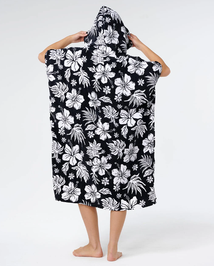Rip Curl Mixed Hooded Towel in black with white floral detail on model from  rear