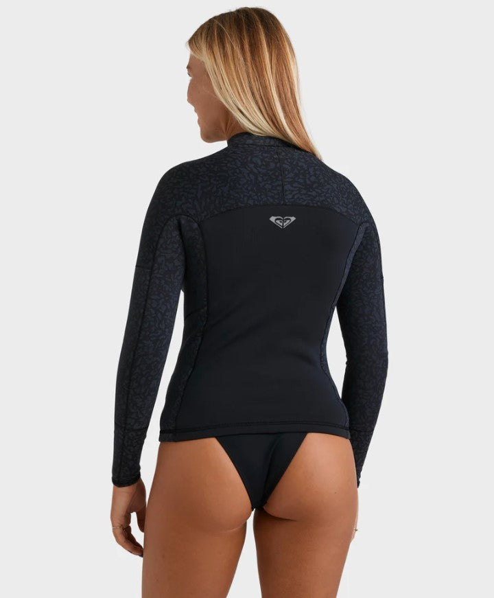 Roxy 1mm Swell Natural Pullover Wetsuit Vest in black with animal print on blonde model from rear