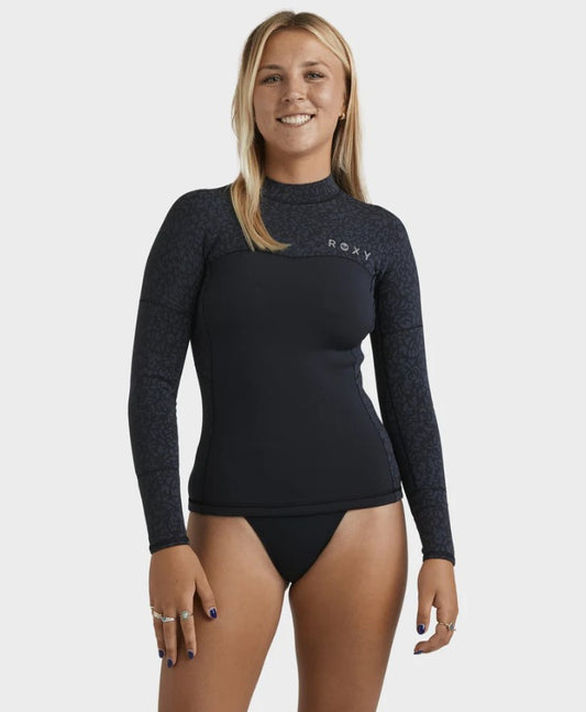 Roxy 1mm Swell Natural Pullover Wetsuit Vest in black with animal print on blonde model from front