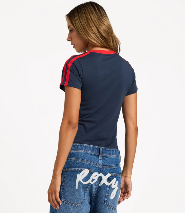 Roxy Game Time Baby Tee in navy with red detail on model from rear