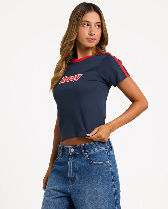 Roxy Game Time Baby Tee in navy with red detail on model from side