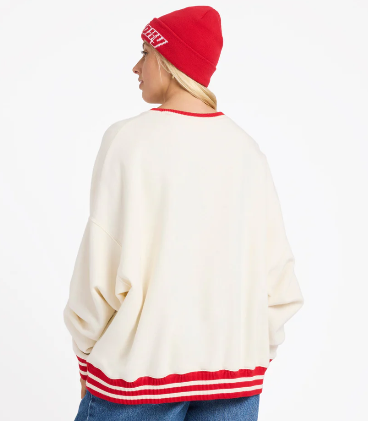 Roxy Game Time Women's Crew in bone colourway with red trim on model in blue Roxy jeans from rear