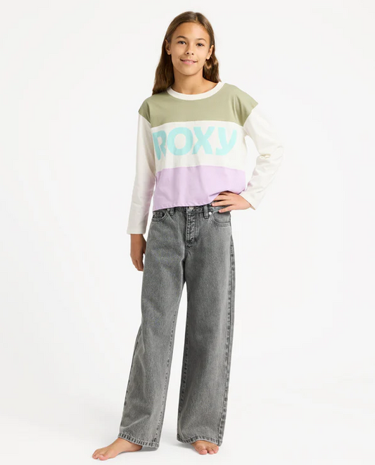 Roxy Dawn Patrol Mid Rise Girls Jeans in lavy colourway on model in roxy top from front