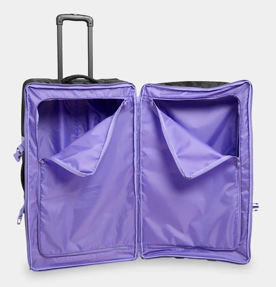 Roxy Long Haul 105 Litre Travel Bag in black with floral embossing and purple trim from the inside showing zip compartments