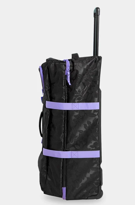 Roxy Long Haul 105 Litre Travel Bag in black with floral embossing and purple trim from the side