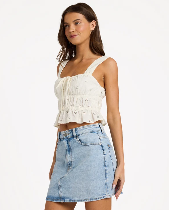 Roxy Lucky One Sunset Mist Tank Top in white on model in denim skirt from side
