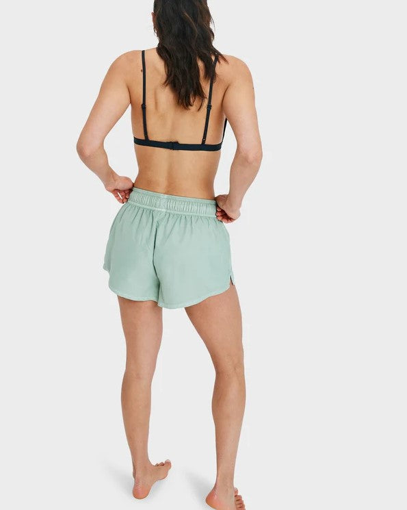 Roxy No Bad Waves Womens 2" Boardshorts in laurel green on model in black bikini top from rear