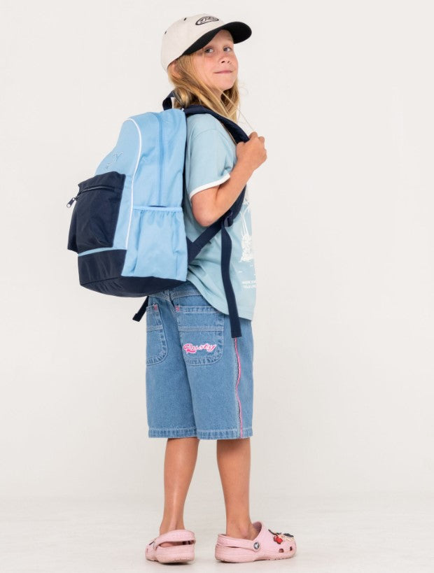Rusty Girls Academy Backpack in retro blue being carried by a girl