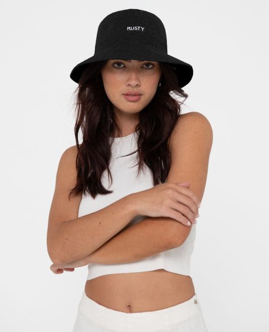 Rusty Bailey Woven Bucket Hat in black on a dark haired model in white clothing on white background