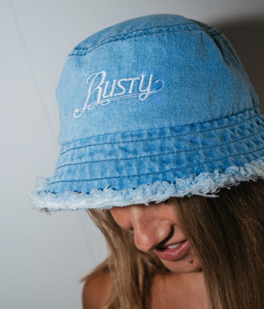 Rusty Beta Denim Bucket Hat in blue on model's head