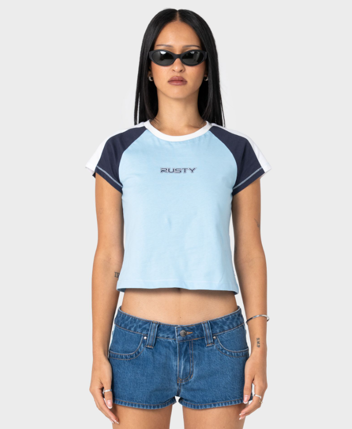 Rusty Bradley Mini Cap Sleeve Women's T-Shirt in light blue with navy sleeves on model from the front