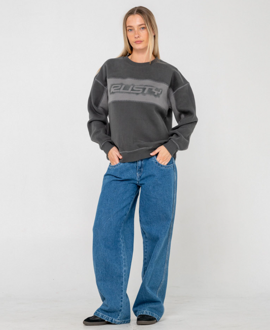 Rusty Choc Top Long Sleeve Oversize Women's Crew in carbon colourway on  model in blue baggy jeans from front