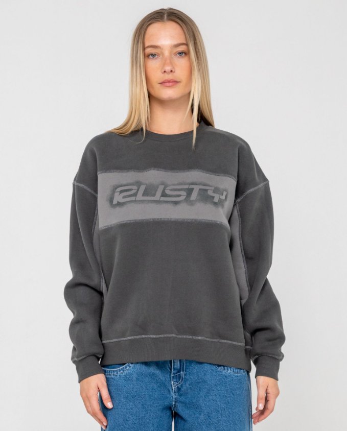 Rusty Choc Top Long Sleeve Oversize Women's Crew in carbon colourway on  model from front close up