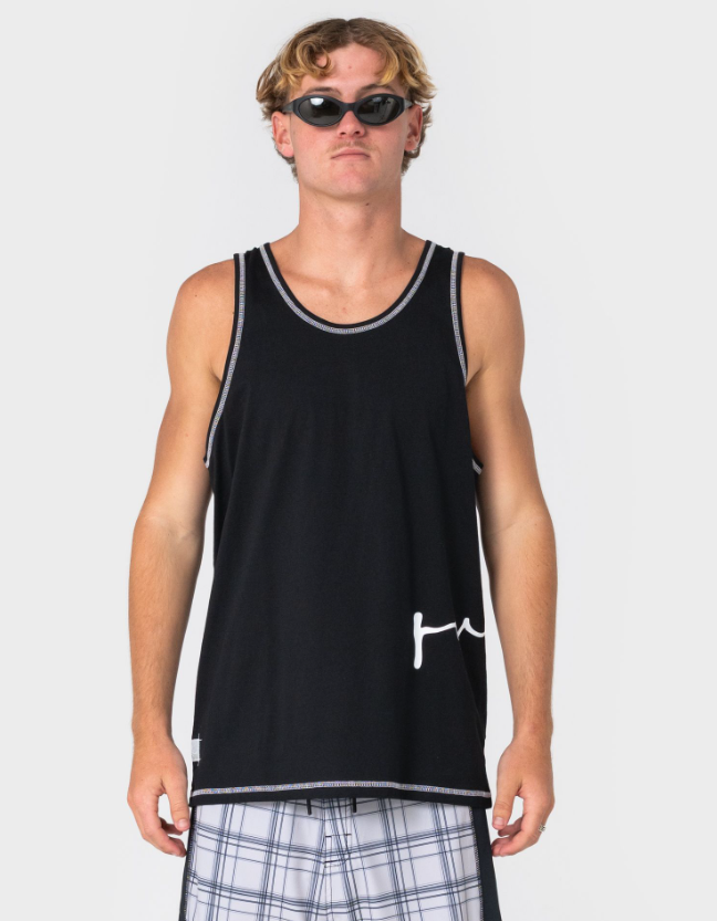 Rusty Crisis Men's Tank in black on model in check boardshorts from the front close up